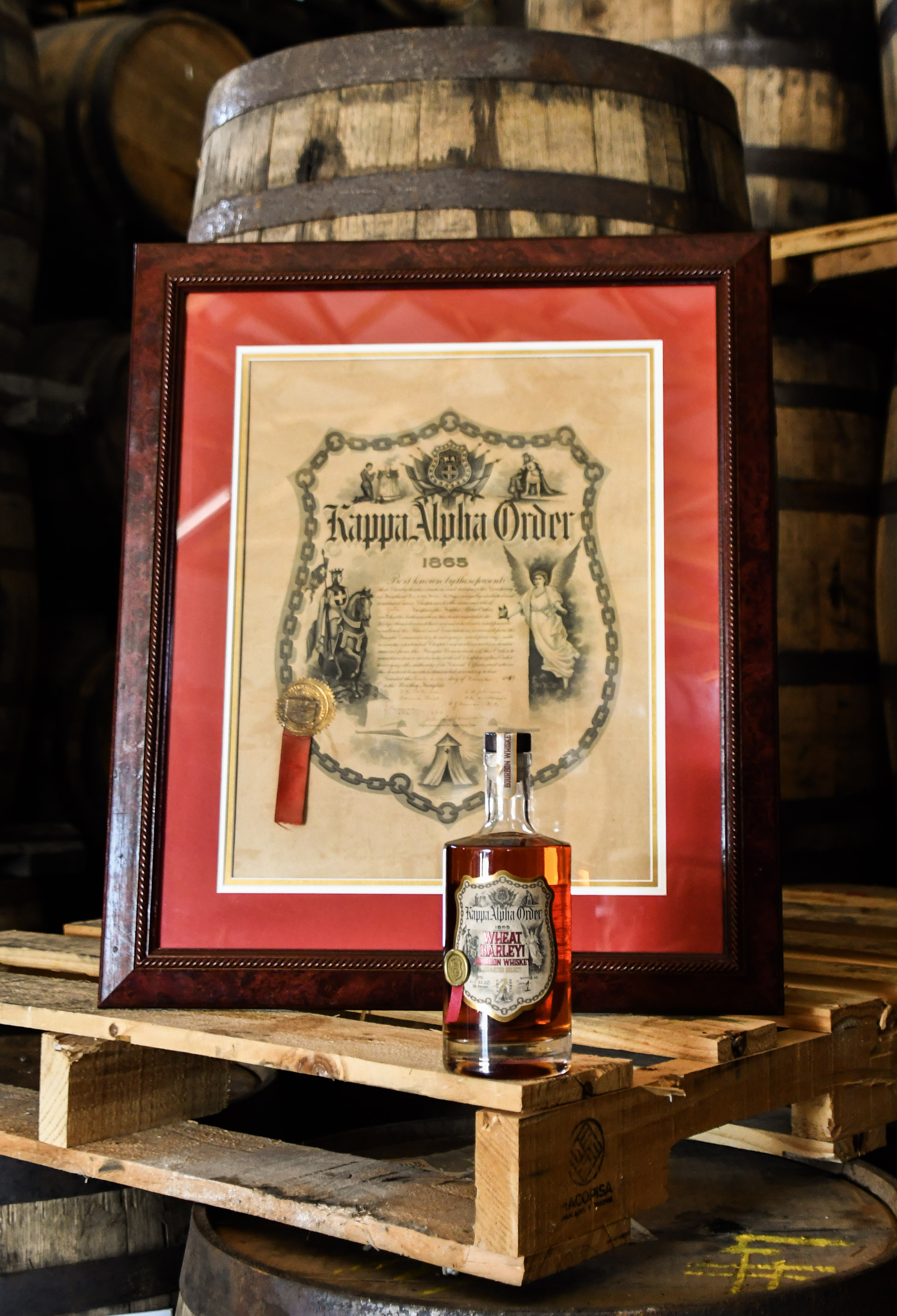 Kappa Alpha Order charter with custom bourbon bottle